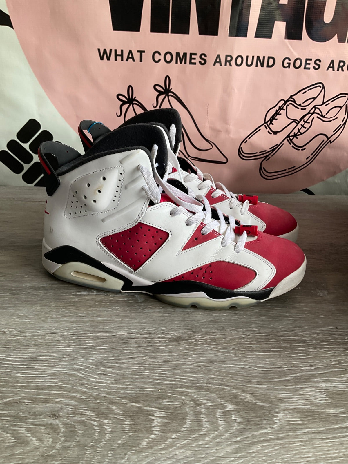 Outer side profile of Jordan Collezione 17/6 in white, red, and black showing perforated leather panels, Air heel cushioning, and black midsole